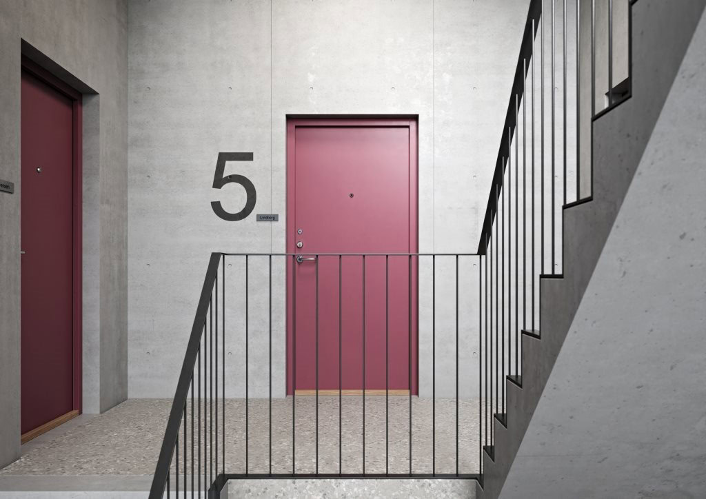 Alt tekst: Modern boligindretning med lyse vægge og farvede døre.